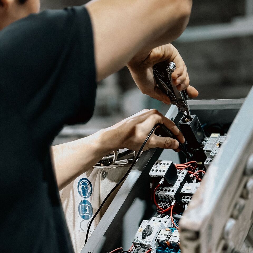 Commercial Electrician Fixing Fuse Box